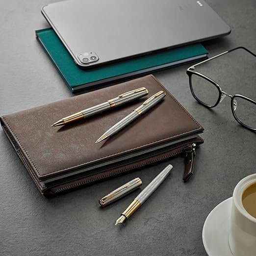 PARKER Sonnet Ballpoint Pen, Prestige Chiselled Silver with Gold Trim, Medium Point Black Ink - الصورة 5